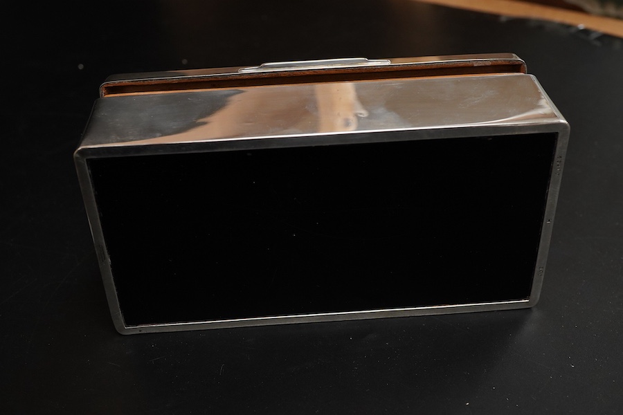 An Elizabeth II silver mounted rectangular cigarette box, with R.A.F. related engraved inscription, Sheffield, 1957, 17.7cm.